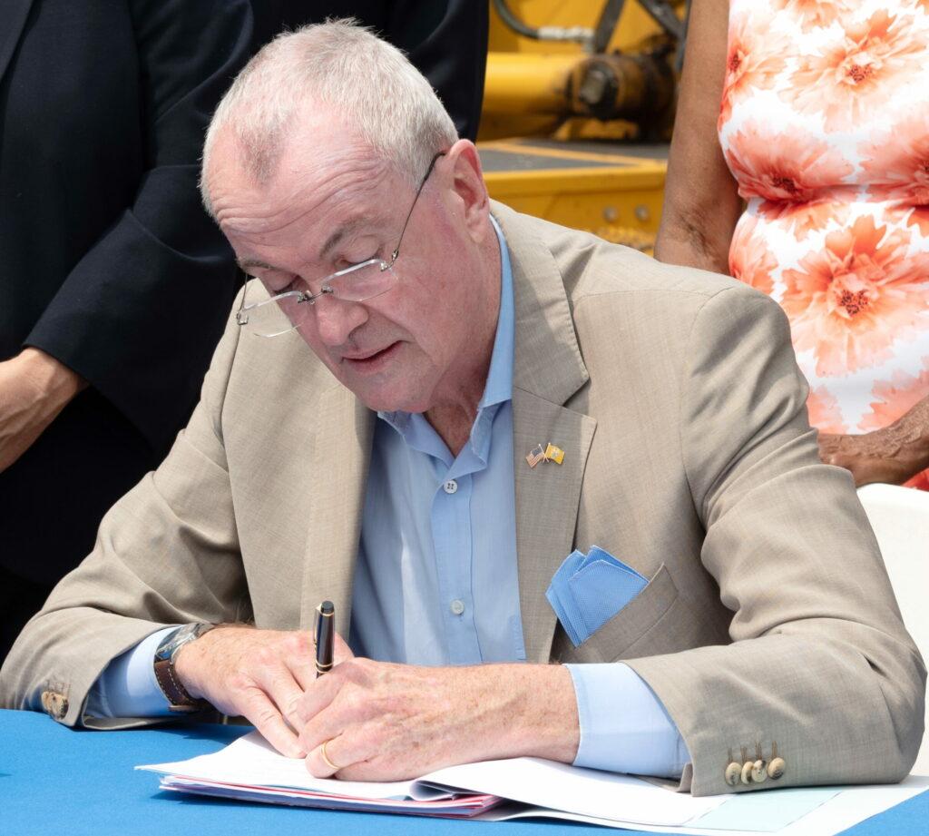 Governor Phil Murphy signing a bill