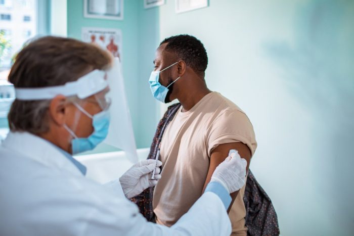 man getting vaccine